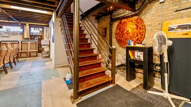 a city street lined with buildings and trees