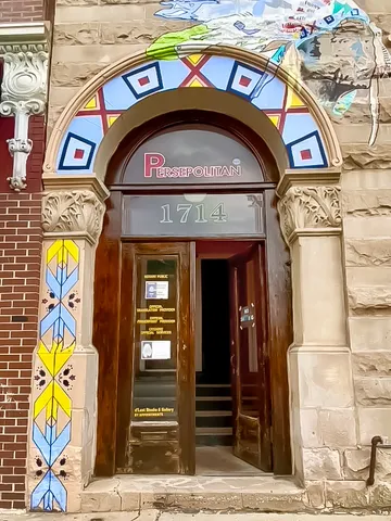 a living room with furniture and flowers