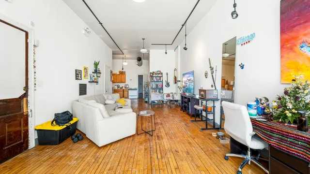 a kitchen with stainless steel appliances granite countertop a refrigerator and stove top oven