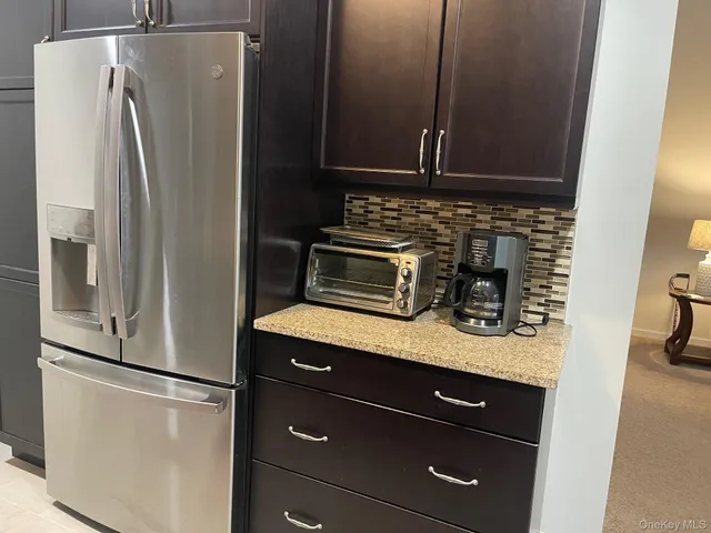 a kitchen with appliances and cabinets