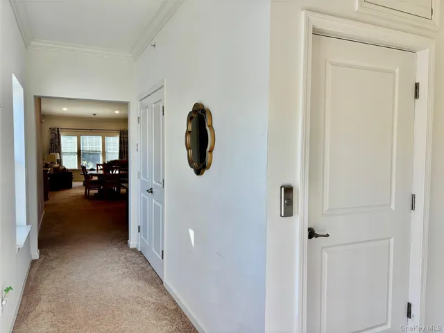 a view of a livingroom from a hallway
