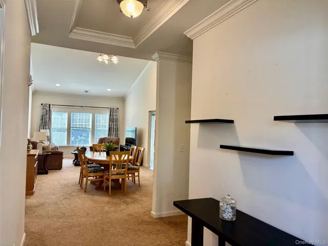 a view of a livingroom with furniture and lounge chair