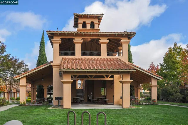 an outdoor space with furniture and umbrella