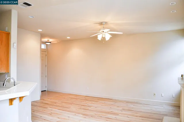 a view of a kitchen with a sink and a stove