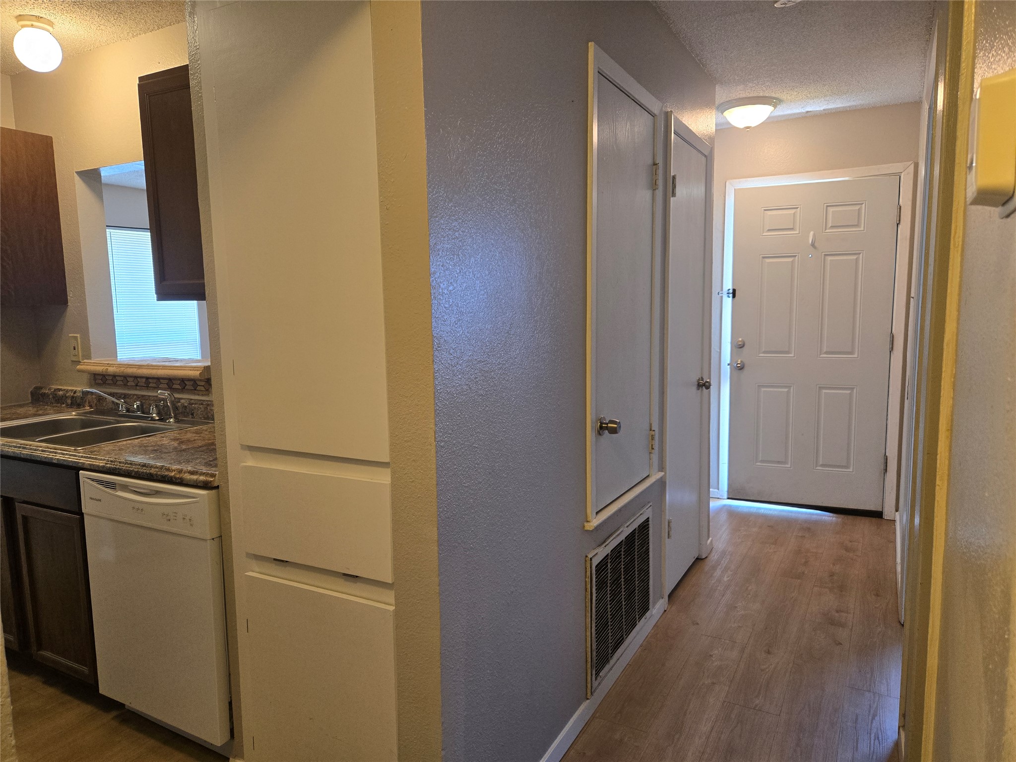 1011 Ridgemont Street Round Rock, TX 78664 - Photo 6 of 14 a kitchen with a refrigerator and a stove top oven