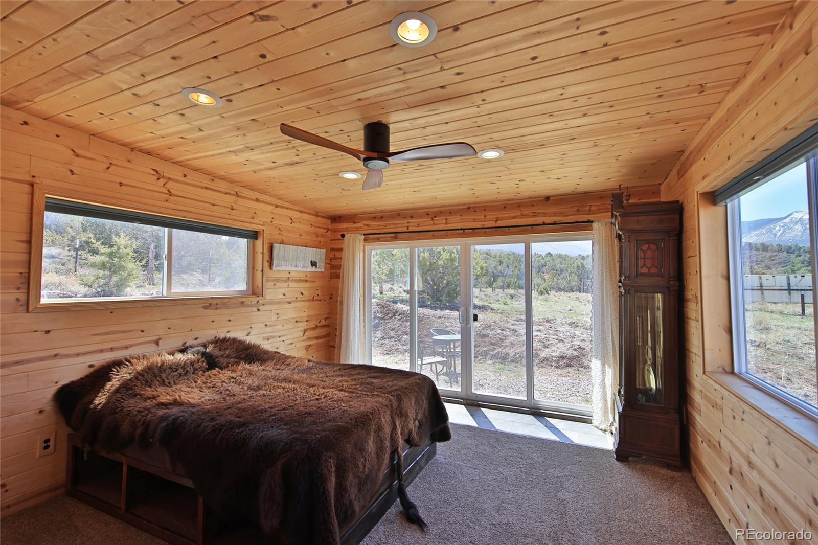 56001 Kk (1 Parcel) Road Molina, CO 81646 - Photo 13 of 43 a bedroom with a bed and a large window