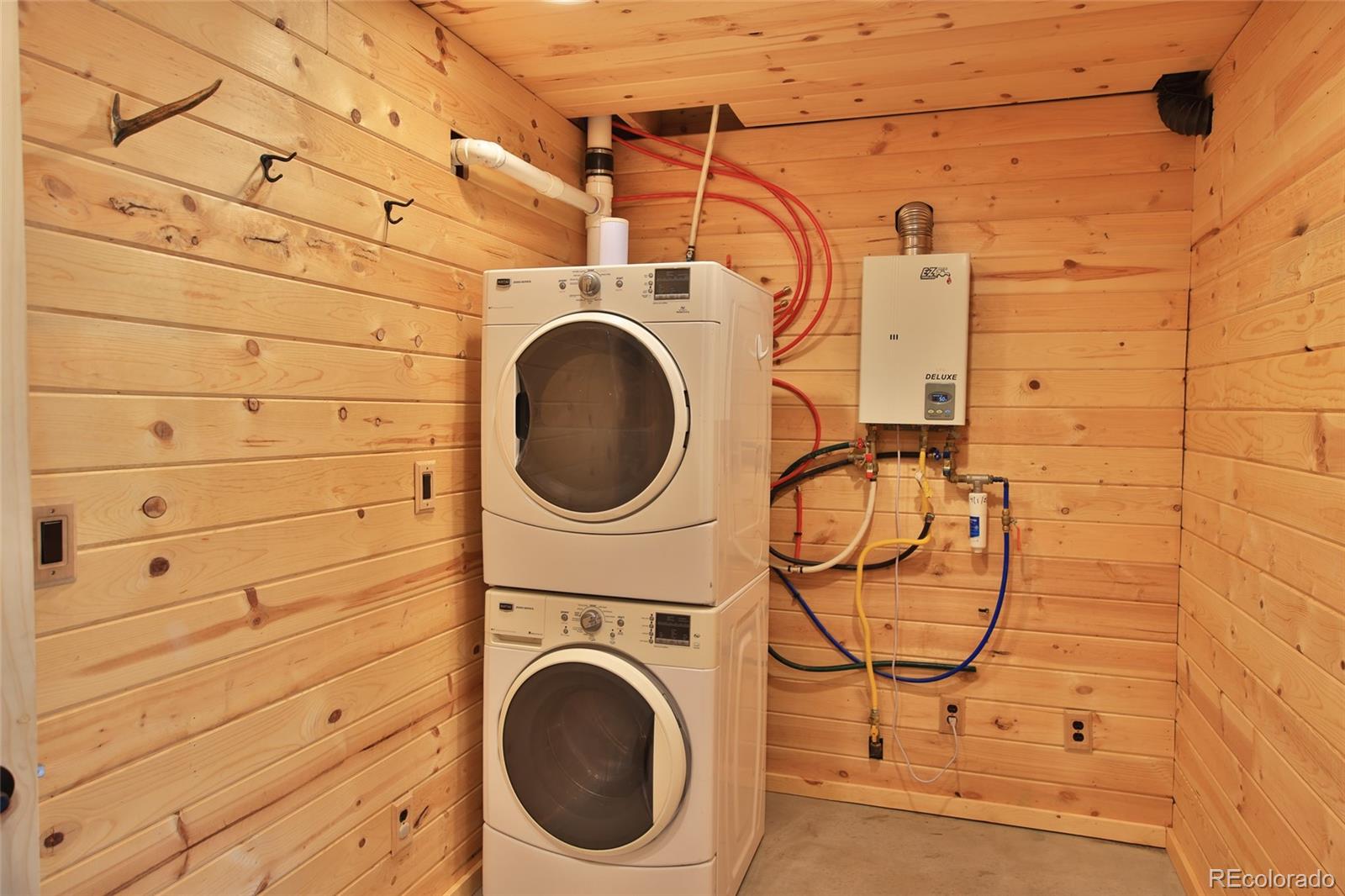 56001 Kk (1 Parcel) Road Molina, CO 81646 - Photo 17 of 43 a utility room with dryer and washer