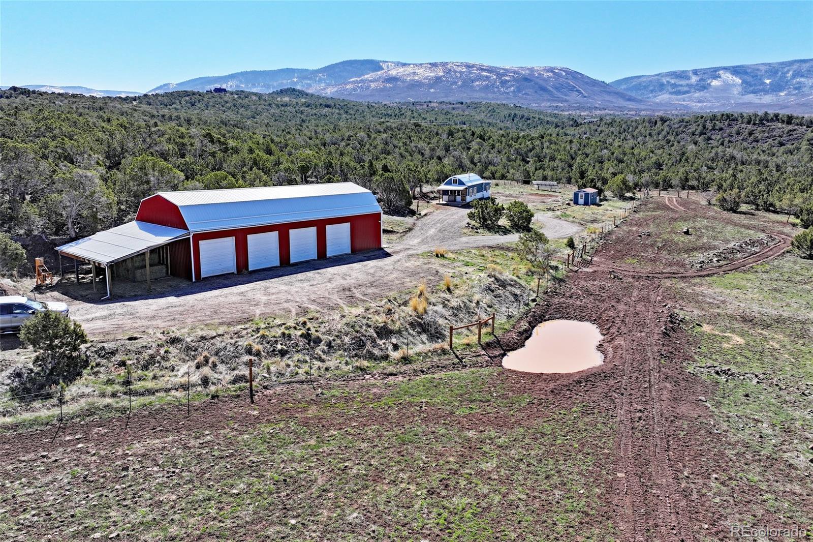 56001 Kk (1 Parcel) Road Molina, CO 81646 - Photo 2 of 43 a view of a back yard with a table and chairs