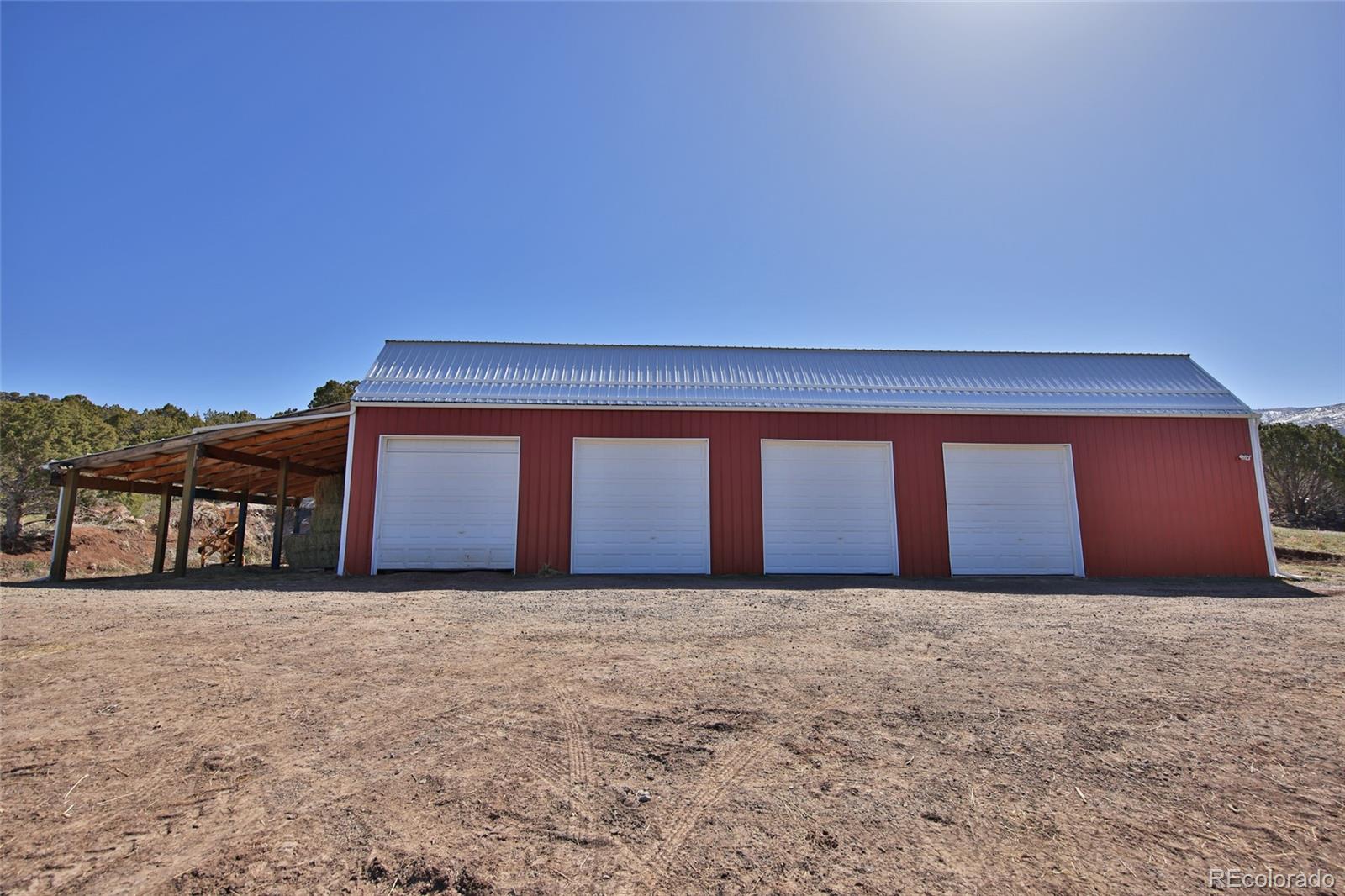 56001 Kk (1 Parcel) Road Molina, CO 81646 - Photo 25 of 43 a front view of a house with a yard