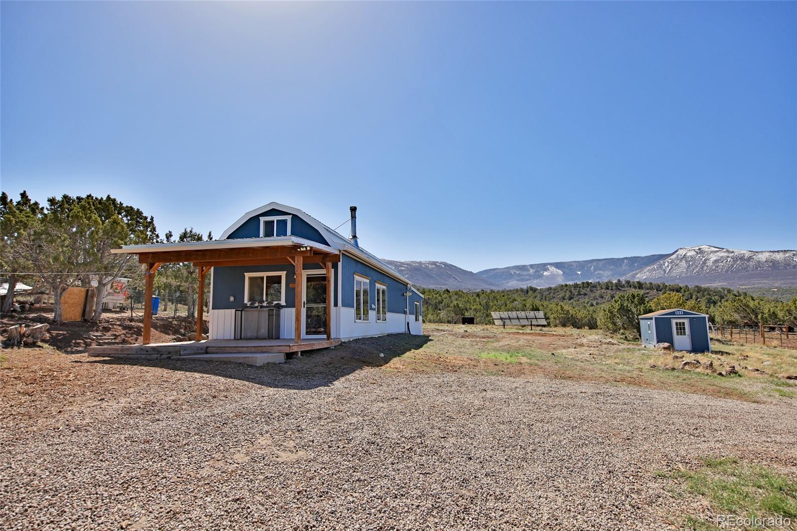 56001 Kk (1 Parcel) Road Molina, CO 81646 - Photo 6 of 43 a front view of a house with a yard