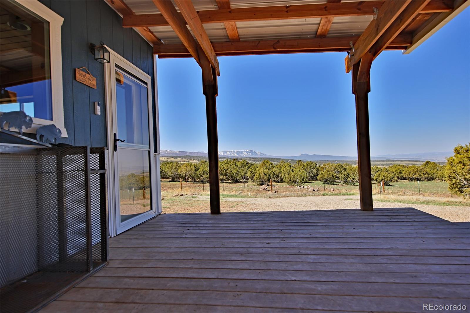56001 Kk (1 Parcel) Road Molina, CO 81646 - Photo 7 of 43 a view of a room with wooden floor and floor to ceiling window