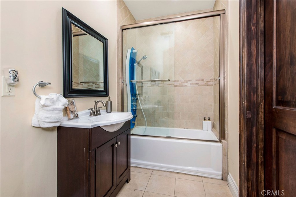 1441 Robmar Drive Beverly Hills, CA 90210 - Photo 21 of 42 a bathroom with a sink and a mirror