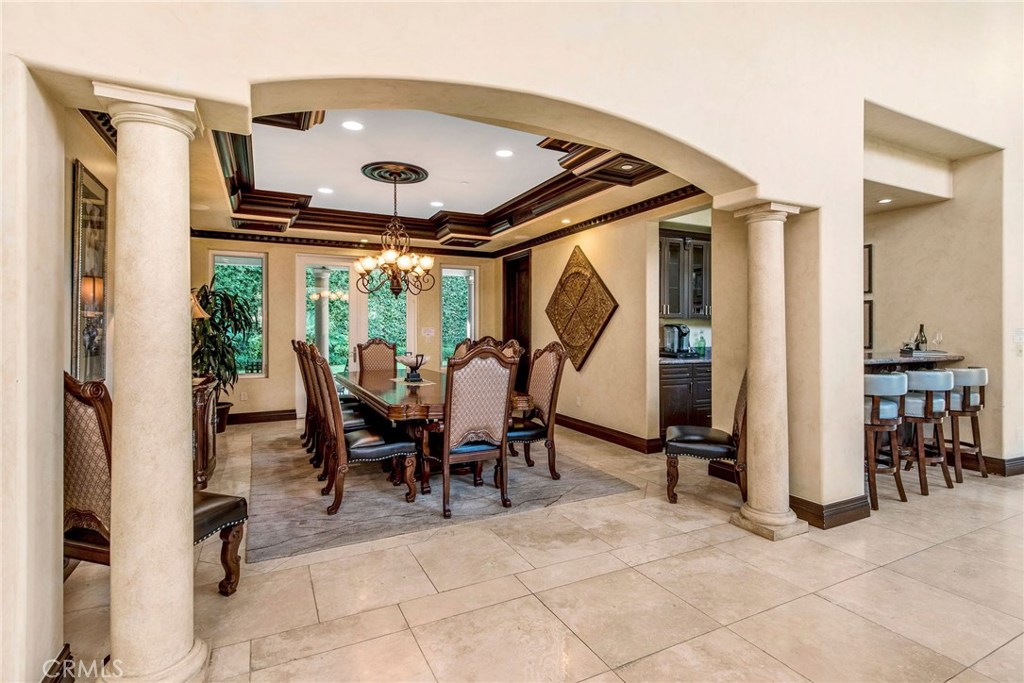 1441 Robmar Drive Beverly Hills, CA 90210 - Photo 23 of 42 a dining room with furniture and a floor to ceiling window