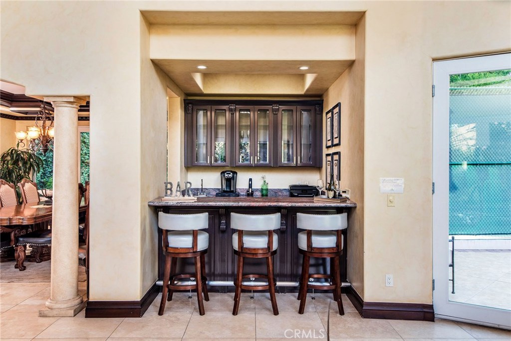 1441 Robmar Drive Beverly Hills, CA 90210 - Photo 24 of 42 a kitchen with a sink cabinets and window