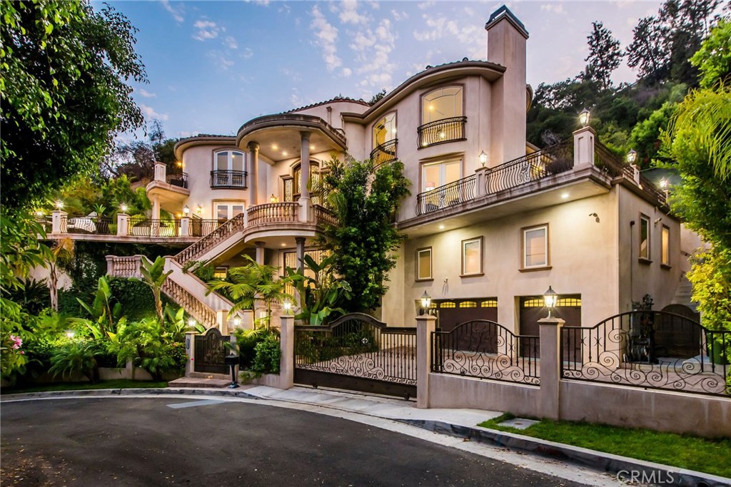 1441 Robmar Drive Beverly Hills, CA 90210 - Photo 3 of 42 a front view of a house with a garden