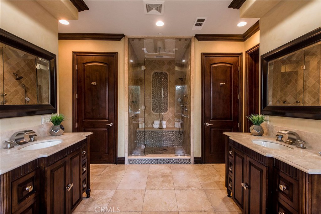 1441 Robmar Drive Beverly Hills, CA 90210 - Photo 34 of 42 a bathroom with double vanity and a bathtub