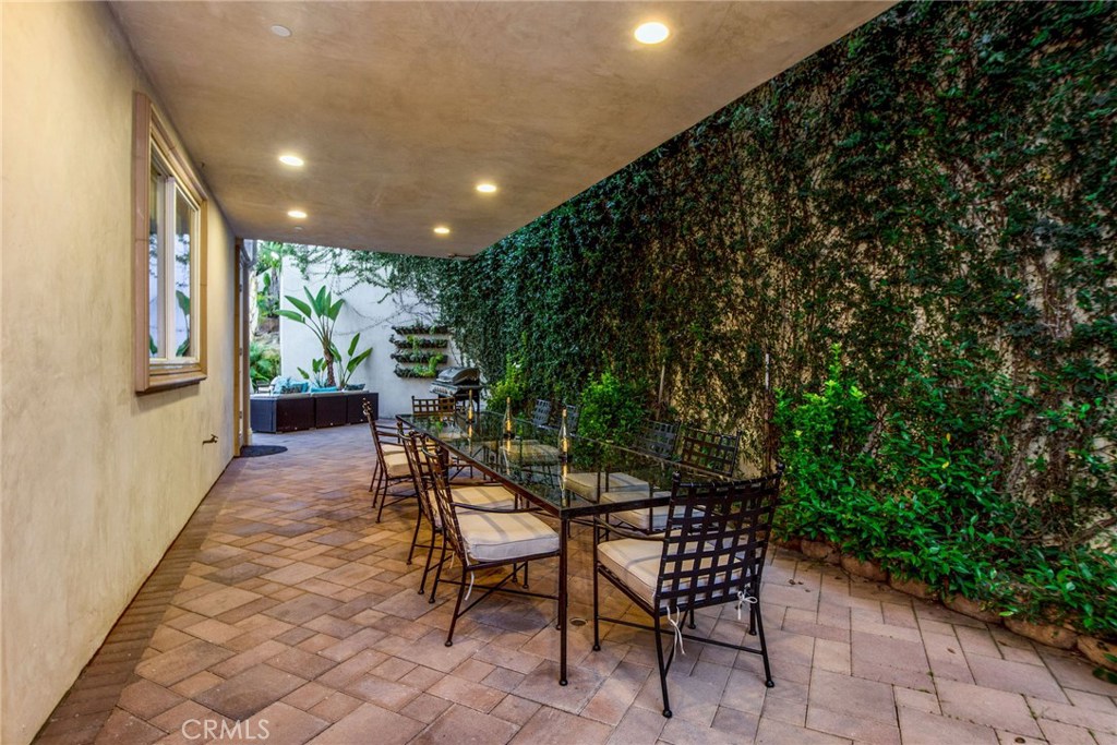 1441 Robmar Drive Beverly Hills, CA 90210 - Photo 37 of 42 a view of a chairs and table in backyard