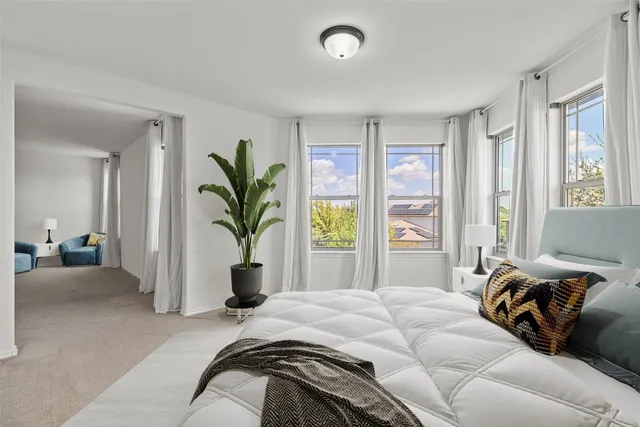 a bedroom with bed and a window