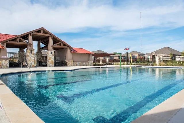a view of pool with outdoor seating