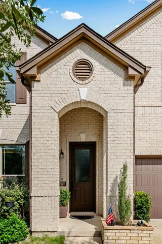 a front view of a house with garage
