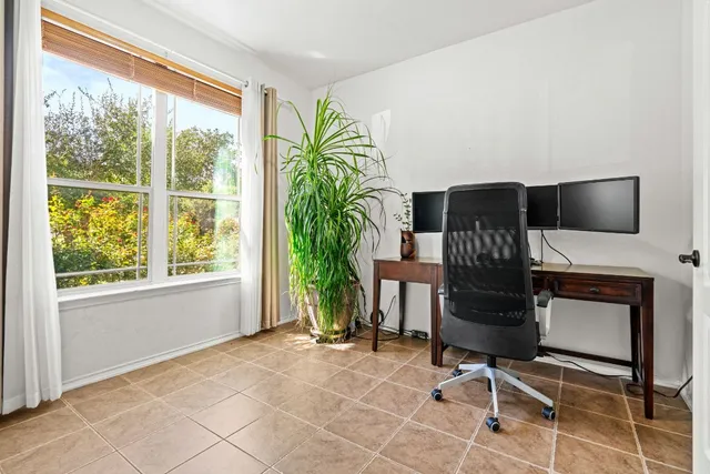 a view of a livingroom with furniture and a window