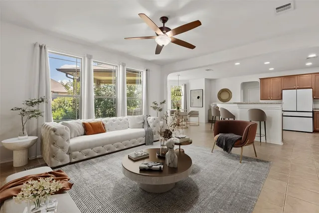 a living room with furniture and a large window