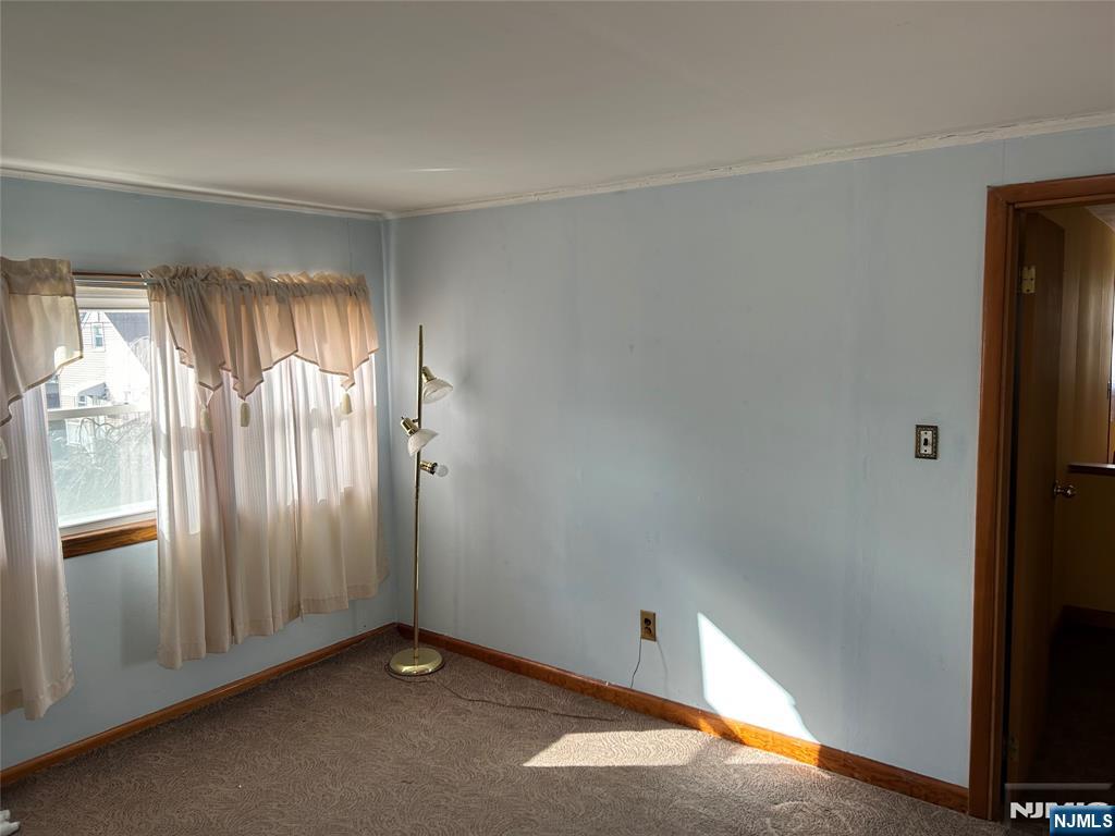 47 Ryle Avenue Little Falls, NJ 07424 - Photo 12 of 18 an empty room with windows