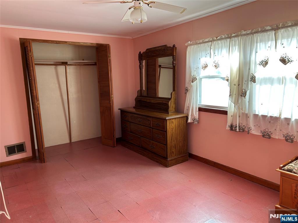 47 Ryle Avenue Little Falls, NJ 07424 - Photo 14 of 18 an empty room with windows and closet