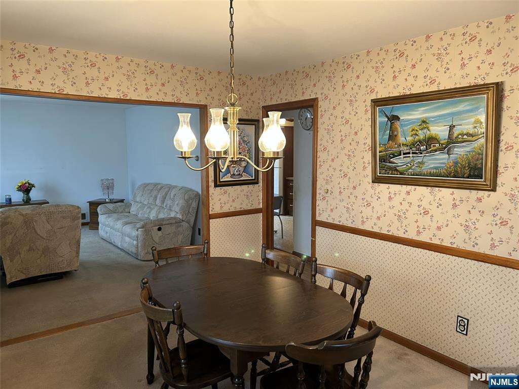 47 Ryle Avenue Little Falls, NJ 07424 - Photo 5 of 18 a view of a dining room with furniture and chandelier