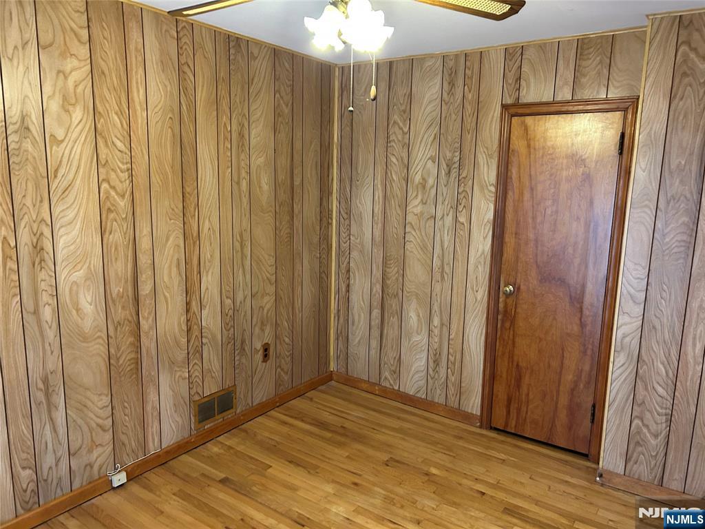 47 Ryle Avenue Little Falls, NJ 07424 - Photo 10 of 18 a view of a elevator with wooden floor
