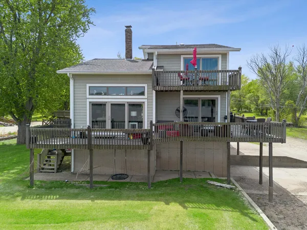 a view of a house with a yard porch and sitting area