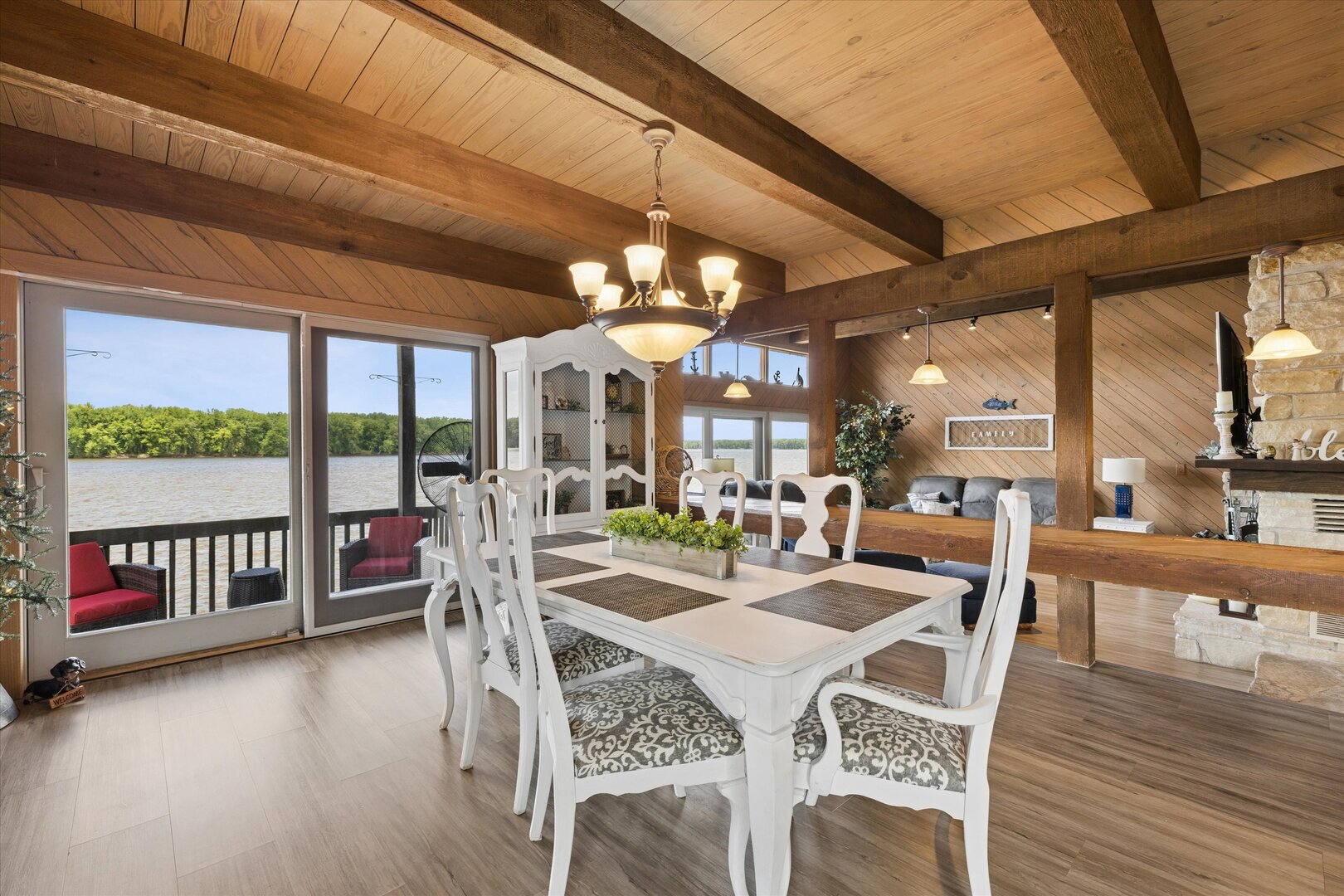 14839 Vans Road Fulton, IL 61252 - Photo 17 of 70 a view of a dining room with furniture wooden floor and chandelier