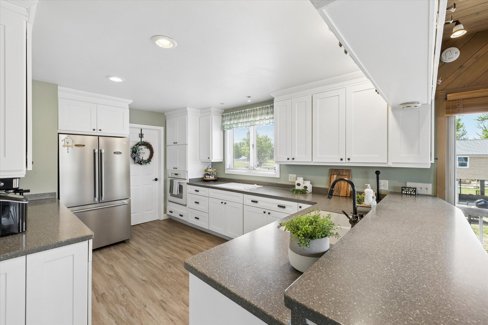 14839 Vans Road Fulton, IL 61252 - Photo 21 of 70 a kitchen with sink refrigerator and microwave