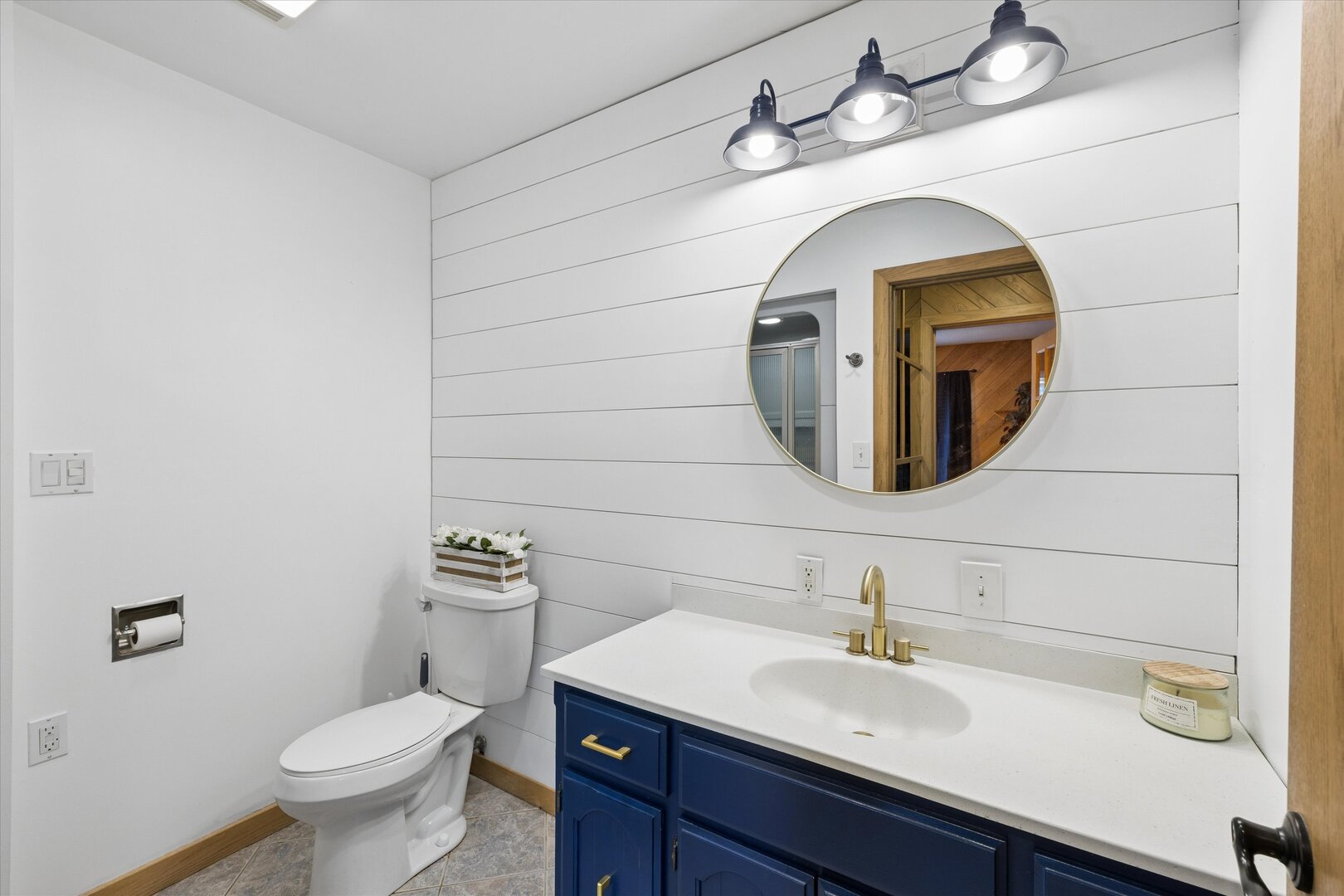 14839 Vans Road Fulton, IL 61252 - Photo 27 of 70 a bathroom with a toilet sink and mirror