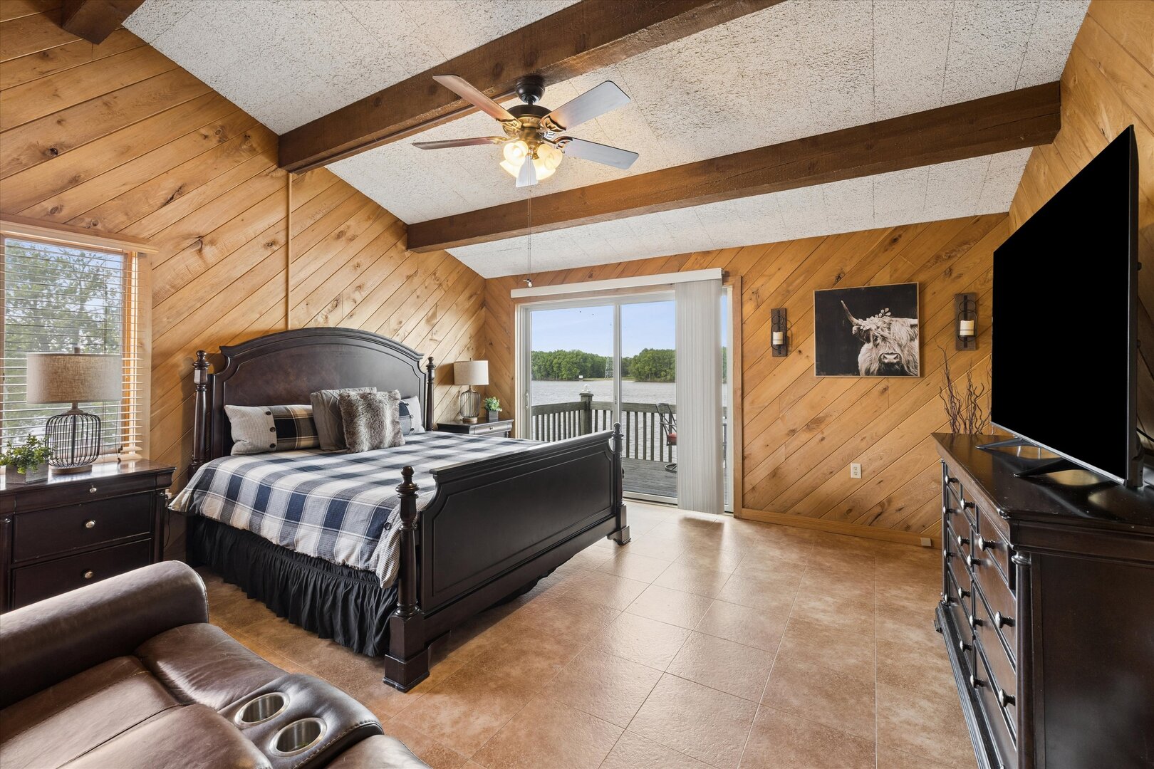 14839 Vans Road Fulton, IL 61252 - Photo 28 of 70 a bedroom with a bed and a flat tv screen on dresser