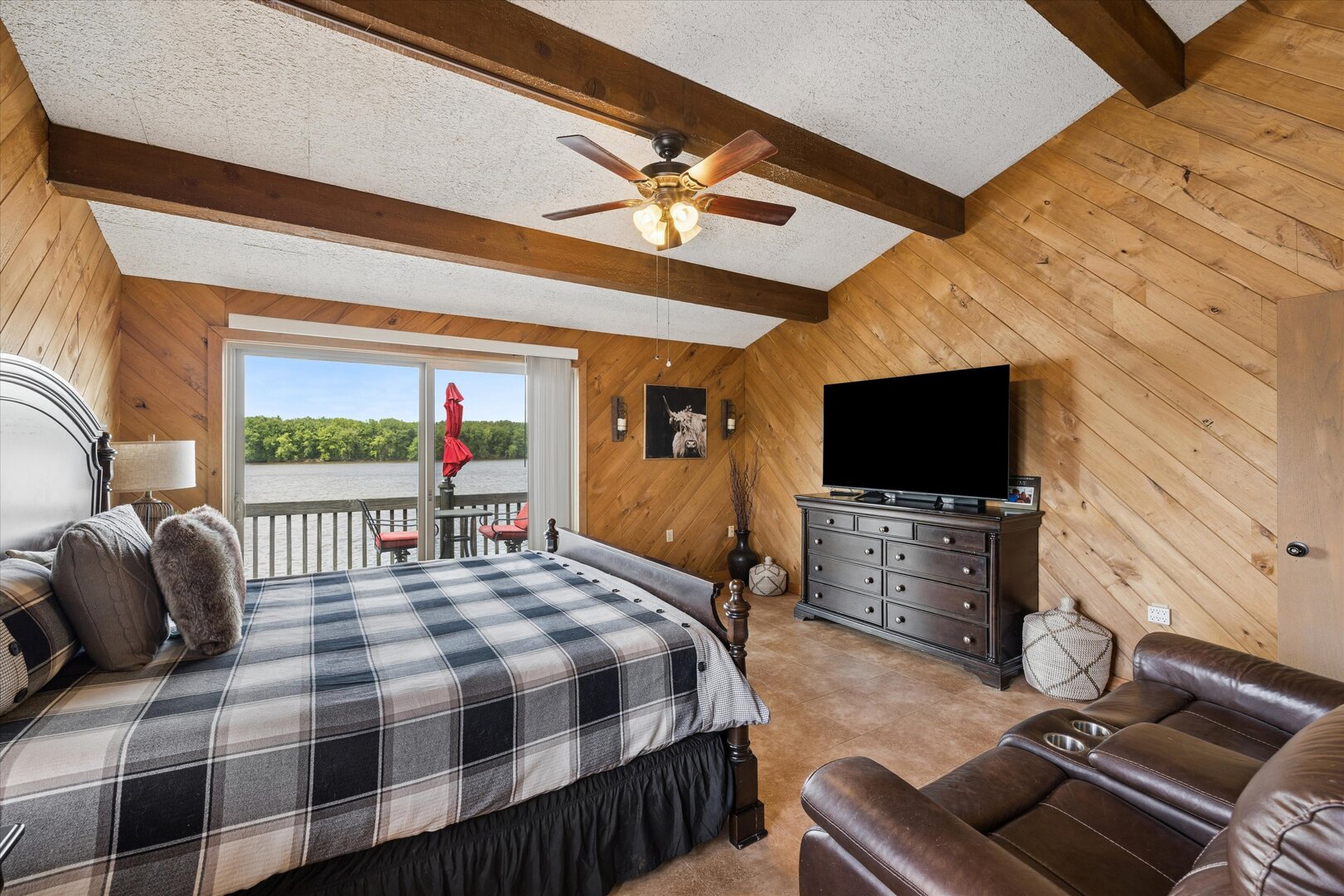 14839 Vans Road Fulton, IL 61252 - Photo 30 of 70 a bedroom with a bed and a flat screen tv
