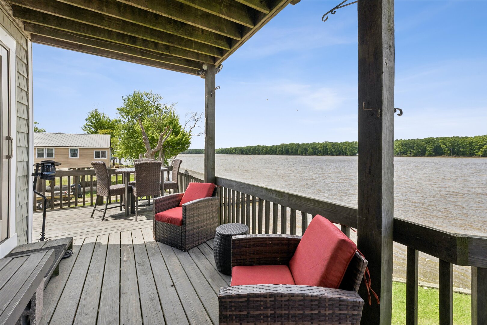 14839 Vans Road Fulton, IL 61252 - Photo 38 of 70 a balcony with wooden floor and outdoor seating