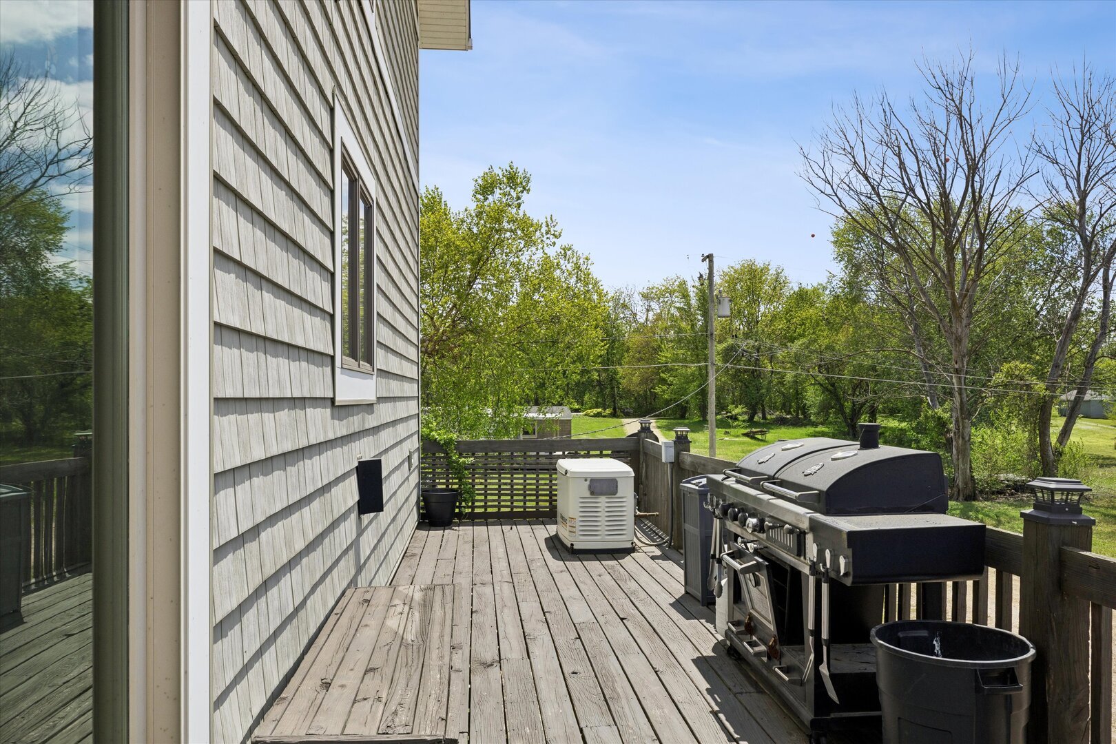 14839 Vans Road Fulton, IL 61252 - Photo 41 of 70 a view of a balcony with chairs and wooden floor