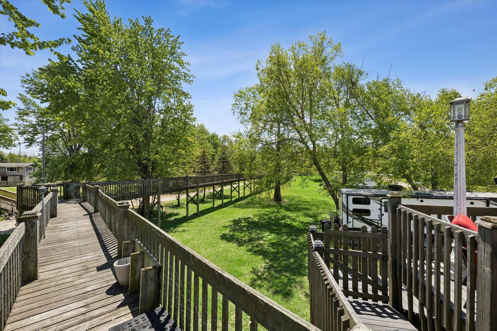 14839 Vans Road Fulton, IL 61252 - Photo 43 of 70 a view of a balcony with wooden fence and floor