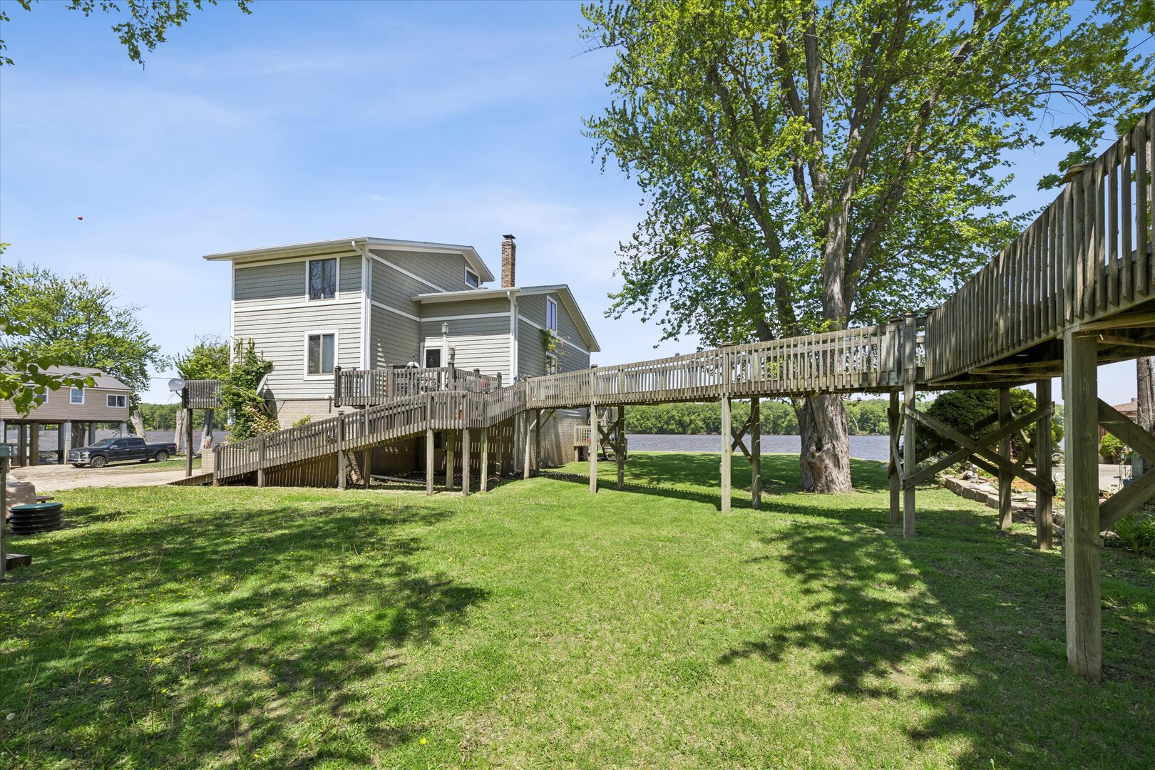 14839 Vans Road Fulton, IL 61252 - Photo 44 of 70 a view of a house with a yard and sitting area