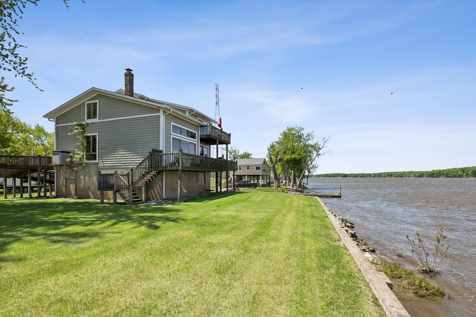 14839 Vans Road Fulton, IL 61252 - Photo 53 of 70 a front view of house with yard and trees in the background