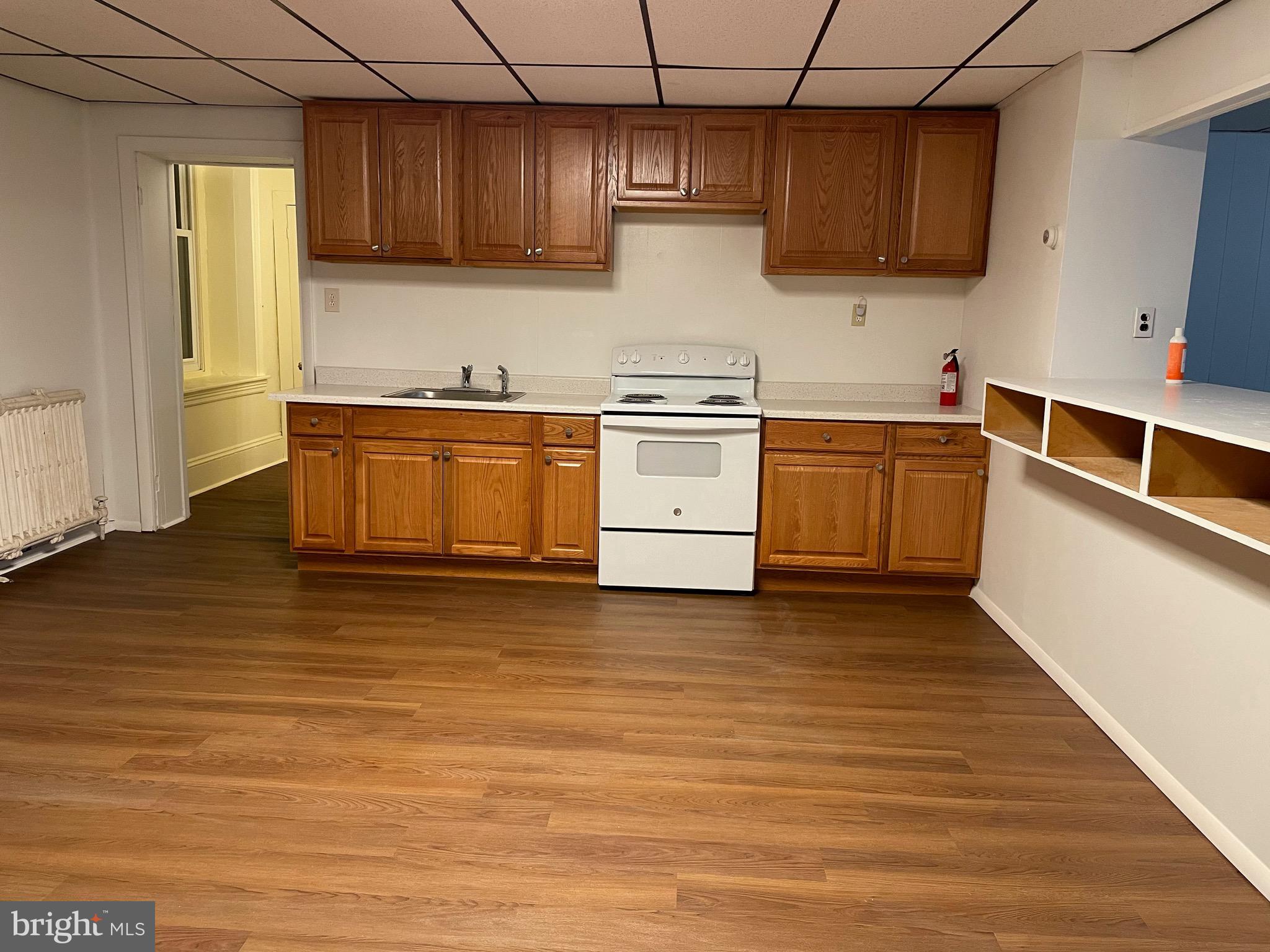 91 A Delaware Road, Unit 2A Riegelsville, PA 18077 - Photo 5 of 10 a kitchen with stainless steel appliances granite countertop a sink a stove and a refrigerator