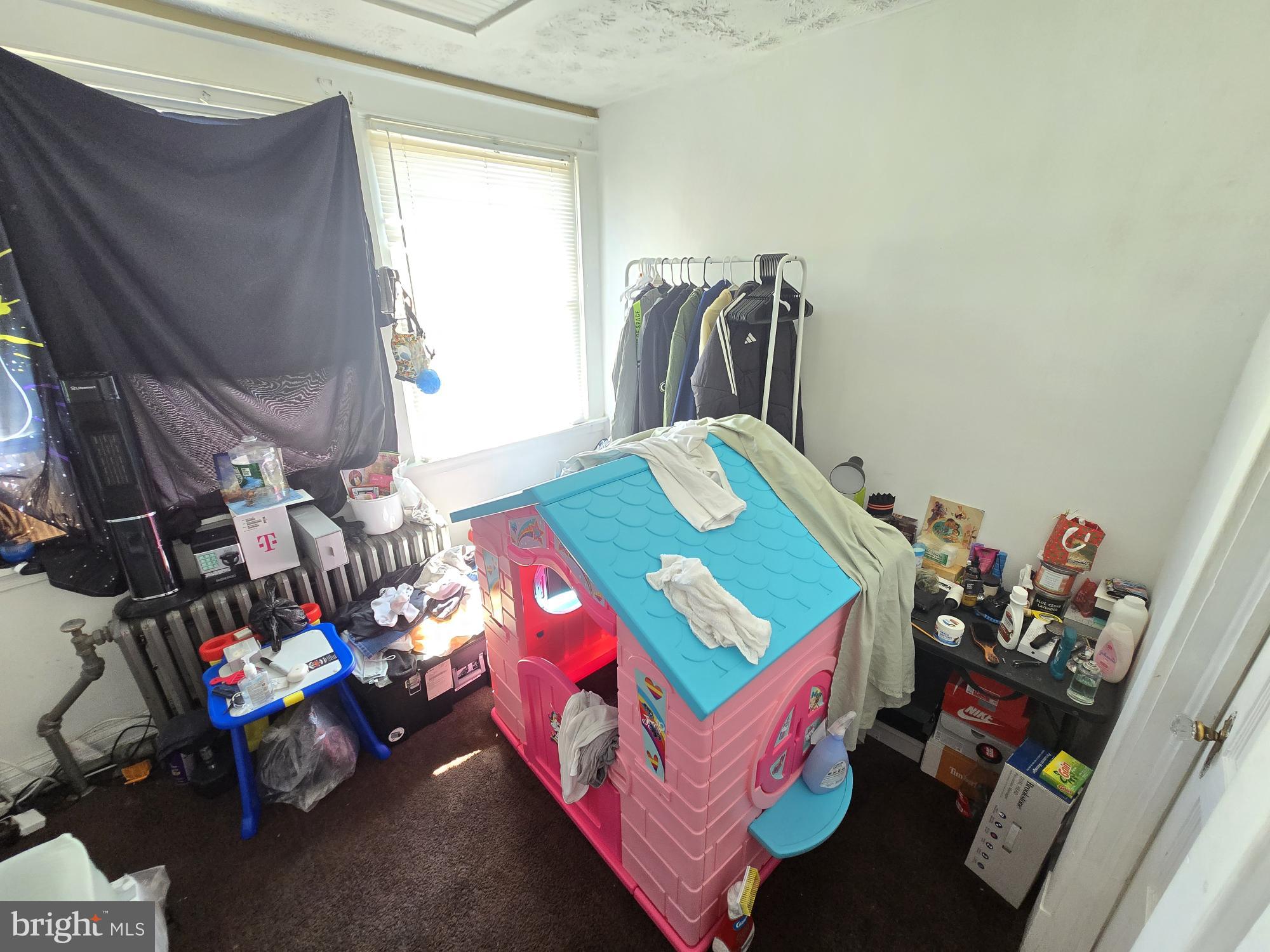 2809 Washington Boulevard Baltimore, MD 21230 - Photo 13 of 21 a bedroom with furniture and a baby crib