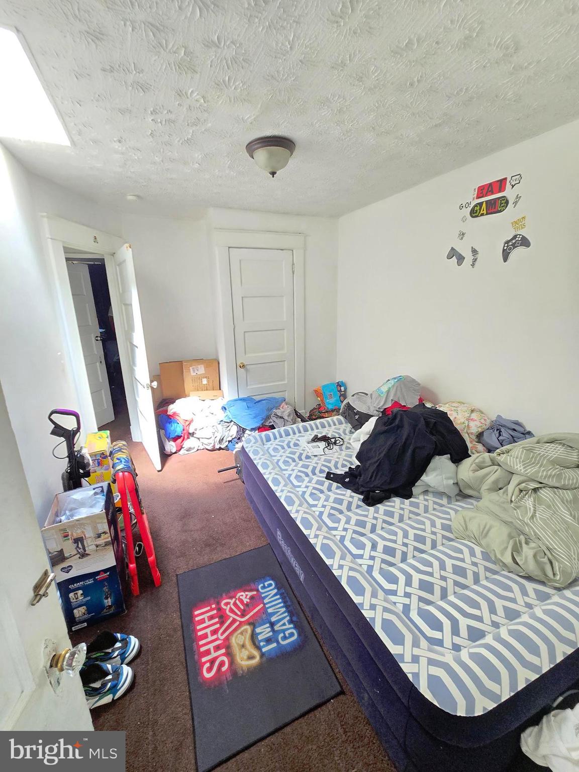 2809 Washington Boulevard Baltimore, MD 21230 - Photo 15 of 21 a bedroom with a bed and dresser