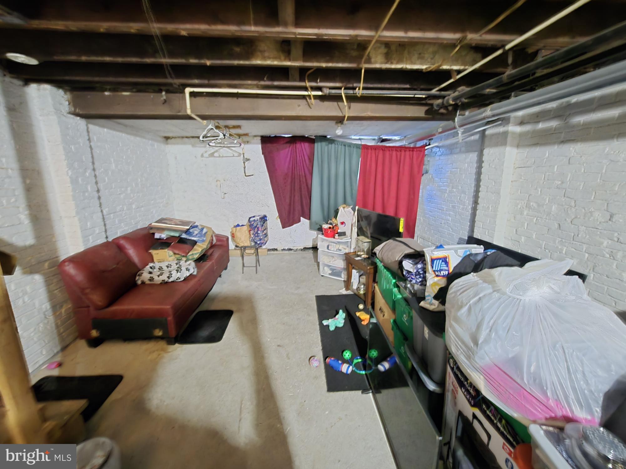 2809 Washington Boulevard Baltimore, MD 21230 - Photo 18 of 21 a bed room with a bed and a chair