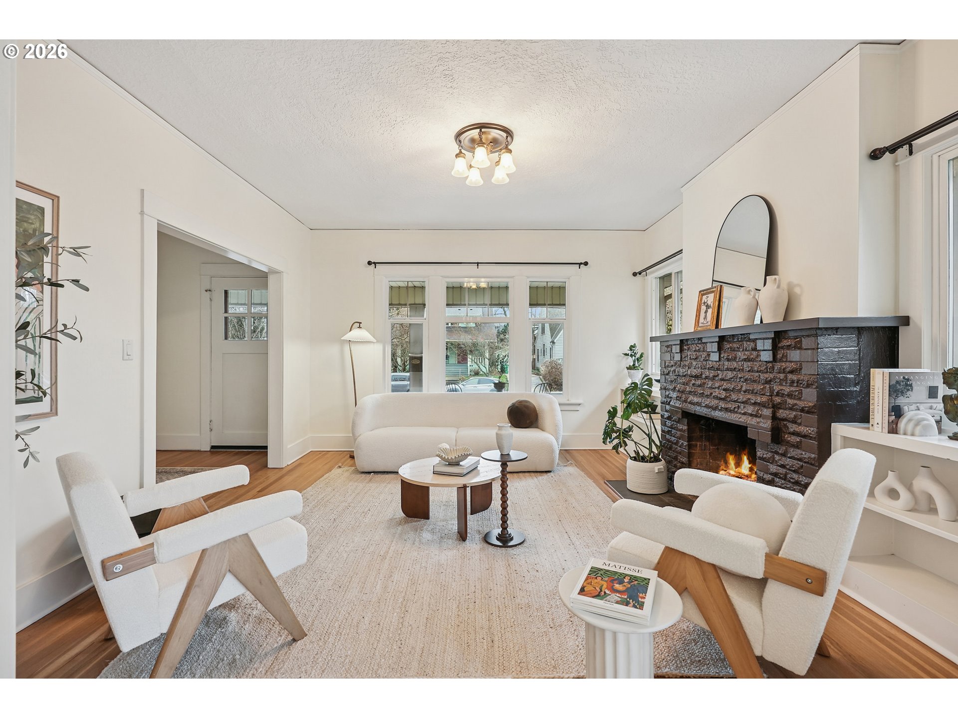 2715 Northeast 38th Avenue Portland, OR 97212 - Photo 13 of 45 a living room with furniture a fireplace and a table