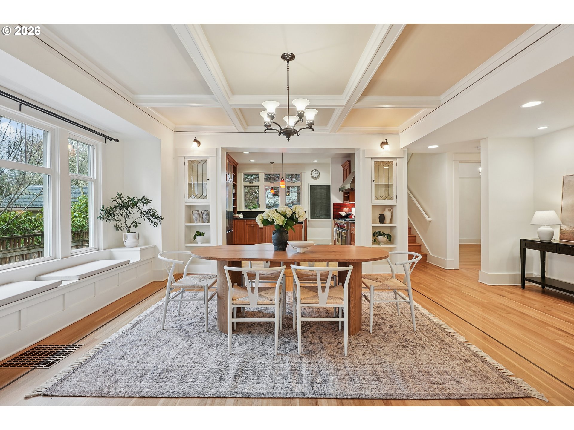 2715 Northeast 38th Avenue Portland, OR 97212 - Photo 16 of 45 a dining room with wooden floor and a chandelier