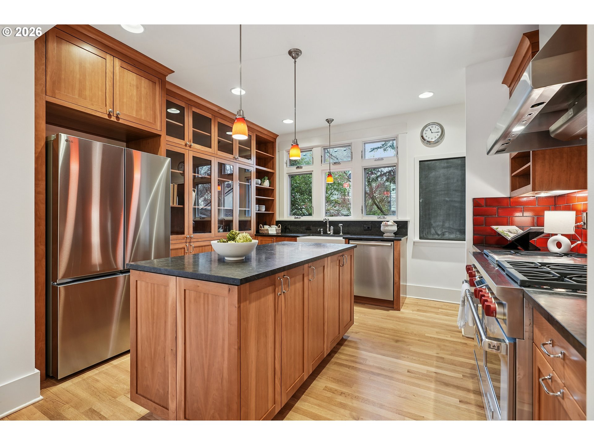 2715 Northeast 38th Avenue Portland, OR 97212 - Photo 20 of 45 a kitchen with stainless steel appliances granite countertop a stove a sink and a refrigerator