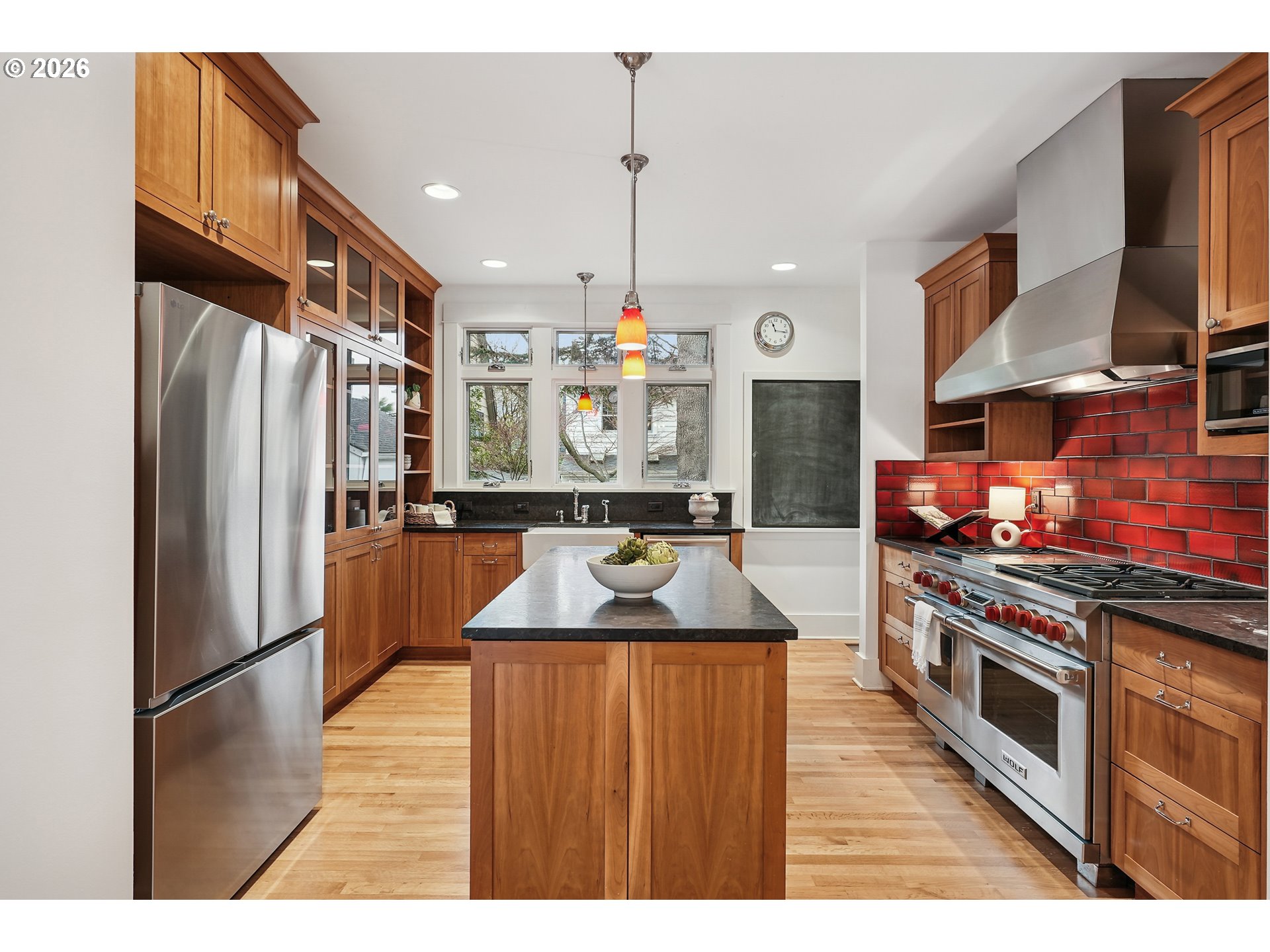 2715 Northeast 38th Avenue Portland, OR 97212 - Photo 21 of 45 a kitchen with stainless steel appliances granite countertop a refrigerator a stove and a sink