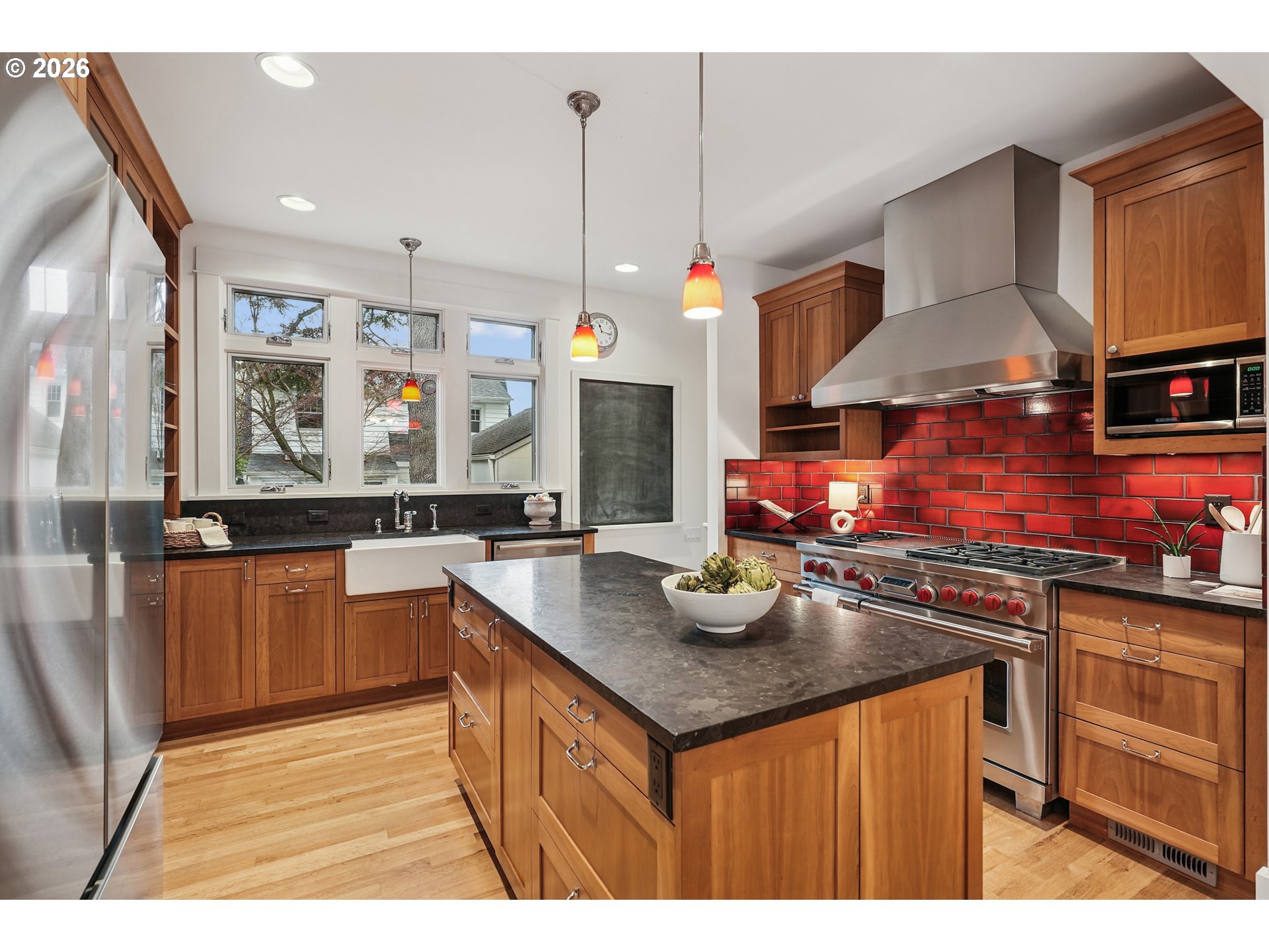2715 Northeast 38th Avenue Portland, OR 97212 - Photo 22 of 45 a kitchen with kitchen island granite countertop a sink counter top space appliances and cabinets